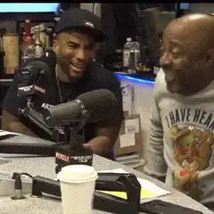 Man falls off chair laughing