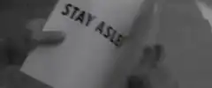 Hand turning pages with slogans