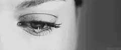 Close-up of a woman's eye with a tear