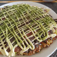 Okonomiyaki with sauce and mayo