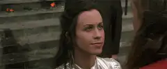 Woman smiles then looks away