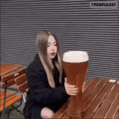 Girl drinks giant beer mug