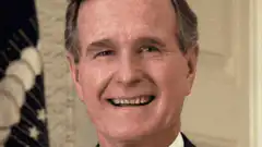 George H.W. Bush smiling then eating a burger