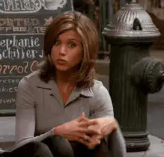 Rachel Green sitting by fire hydrant