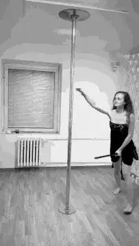 woman pole dancing in black and white