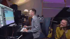 Man typing at computer in studio