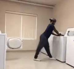 Man dancing in laundry room