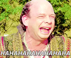 Man laughing hysterically then falling over