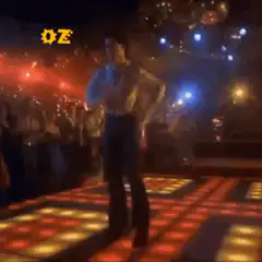 John Travolta dancing on a light-up floor