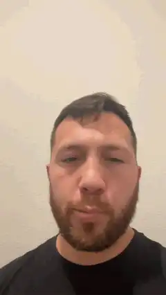 Man blinking and nodding