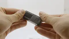Hands holding a Jade hardware wallet