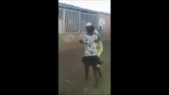 Woman tackles man in yellow outfit
