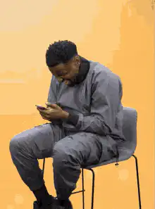 Man laughing at phone