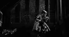 man reaching for woman on stairs