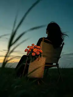woman with roses at sunset