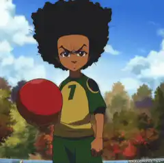 Kid with afro holding red ball