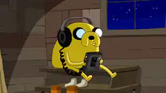 Jake playing handheld game with headphones