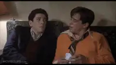 Two men on a couch talking