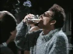 Elaine drinks water and smokes a cigarette