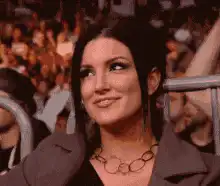 Gina Carano smiling and looking around