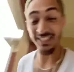 Man laughing while holding Clorox bleach