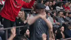Old man dancing in crowd