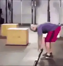 man does pushup with barbell