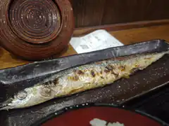 Grilled fish on a long plate