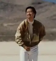 Bruce Lee pointing in the desert