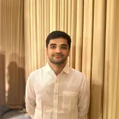 Man in white shirt smiling
