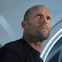 Jason Statham looking up in shock