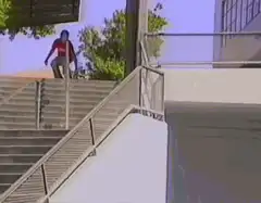 skateboarder jumps down stairs