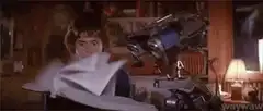 Robot arm feeds paper into scanner