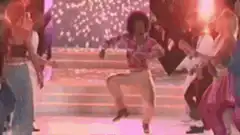 Woman in afro dancing on stage