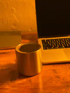steaming metal cup on desk