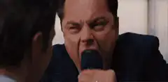 Leonardo DiCaprio yelling into a microphone