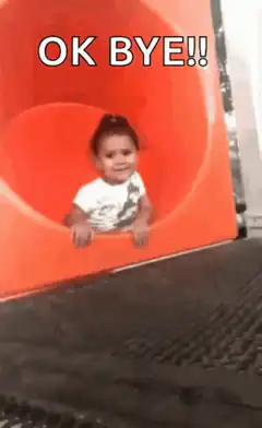Baby slides down orange tube OK BYE