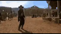 Cowboy dancing in western town
