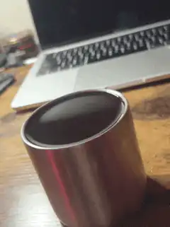 coffee cup on desk with laptop