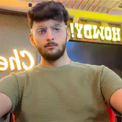 Man in green shirt and glasses