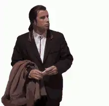 John Travolta holding a coat and gesturing