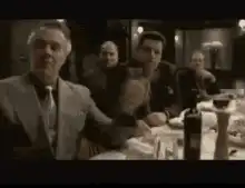 Don Corleone clapping at the table