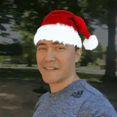 Man in Santa hat with glowing eyes