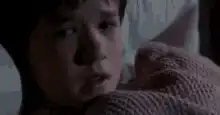 Young boy looking sad and teary