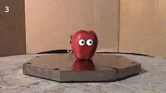 Apple and Metal Cylinder with Eyes