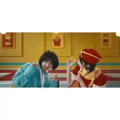 Two girls dancing in a diner