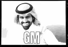 Smiling man in keffiyeh with GM text and hearts