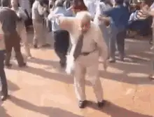 Old man dancing in white suit