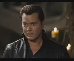 Ray Liotta smirking in a leather jacket