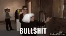 Woman pointing at wall saying bullshit derivative
